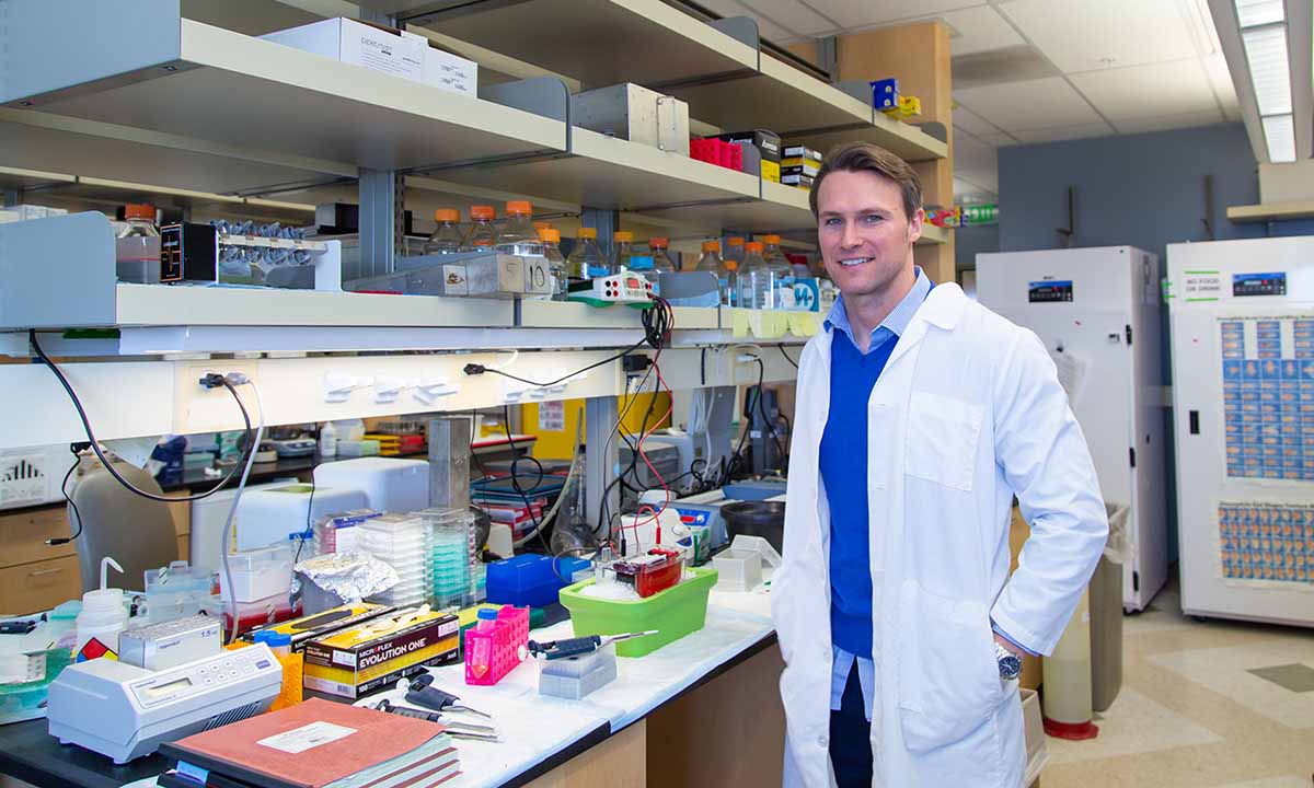Steven Baker stands in a research laboratory.